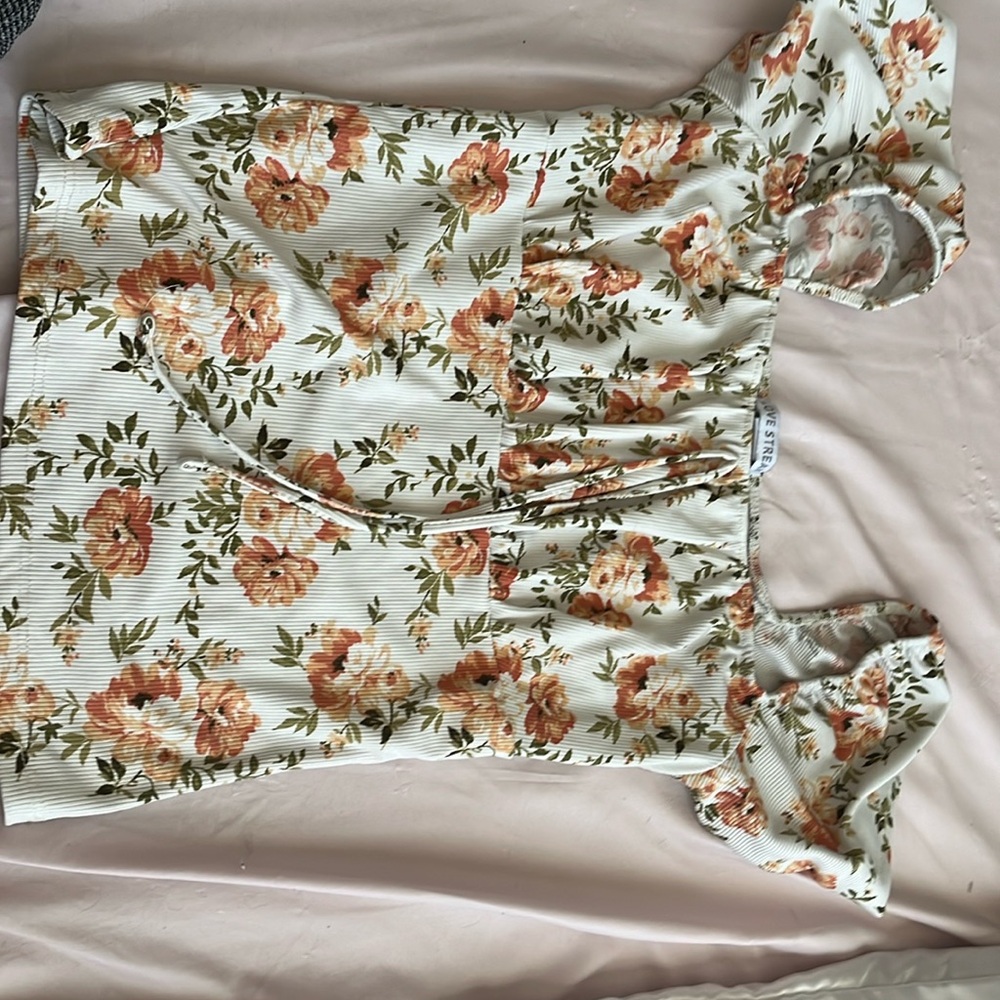 Orange flower, adjustable shoulder, new condition, no stains or loose threads